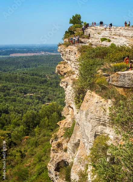 Obraz Seen on the cliff of Baux-de-Provence and tourists, Panorama of the countryside seen on the Alpilles massif. Bouches-du-Rhone, France