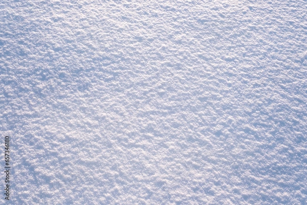 Fototapeta Snow surface close-up. Winter sunny day, frosty mood. Natural texture background. Copy space, top view.