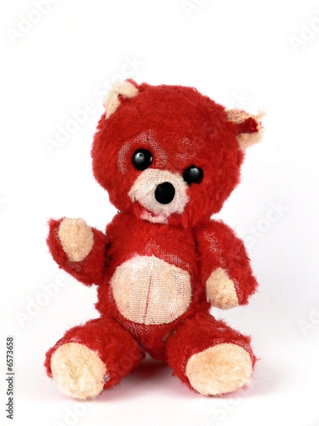 Fototapeta Threadbare old bear on white background