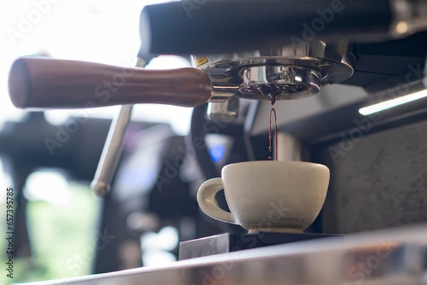 Fototapeta pull espresso shot with bottomless portafilter on a professional coffee machine