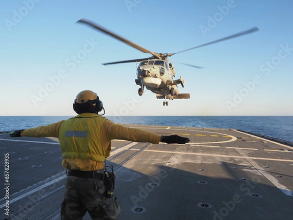 Obraz Navy helicopter landing on warship