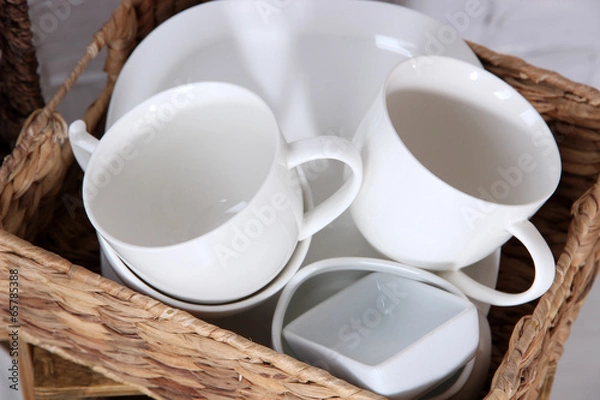 Fototapeta Beautiful shelves and boxes with tableware