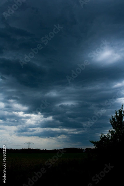 Obraz dark ominous clouds in the sky