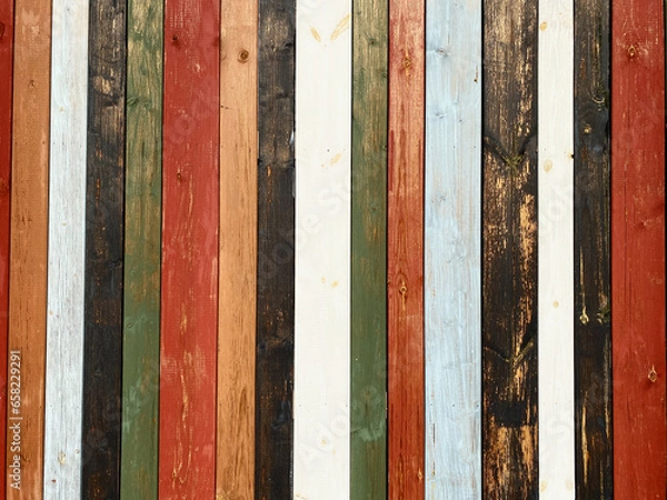 Fototapeta Colorful texture of painted in different bright colors wooden boards close up. Colorful surface of wooden wall from painted boards close-up.