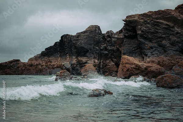 Obraz Rough sea hitting rocky cliffs 