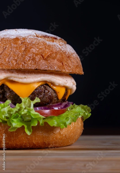 Obraz Beef burger with lettuce, tomato, cheddar cheese and onion