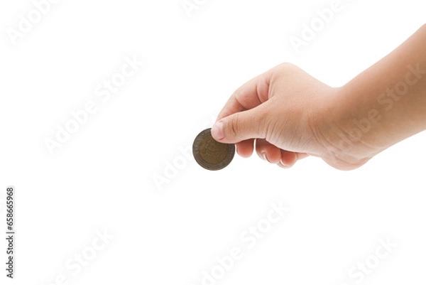Obraz child hand holding a coin from the top isolated on white background, clipping path included. Copy space for your text