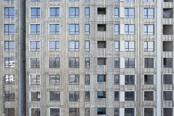 Fototapeta Facade work on a building under construction