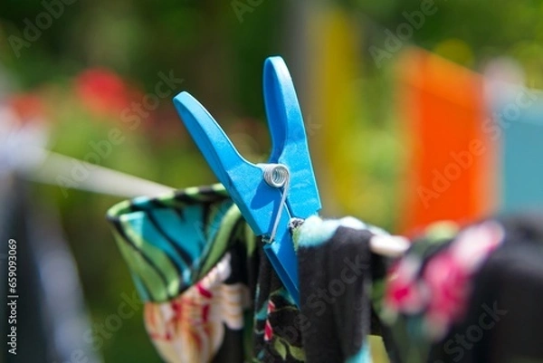 Obraz hanging laundry in the garden on a string              
