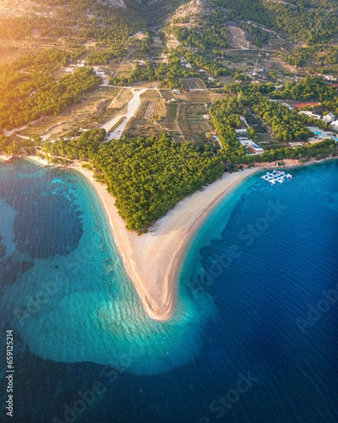 Fototapeta Coastline of Brac, Croatia during sunset with the golden horn beach called Zlatni Rat in the center