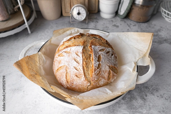 Fototapeta The sourdough bread or artisan bread in the Dutch oven pan. Healthy breakfast bread. Natural yeast fermentation for bakery and baking pastry.