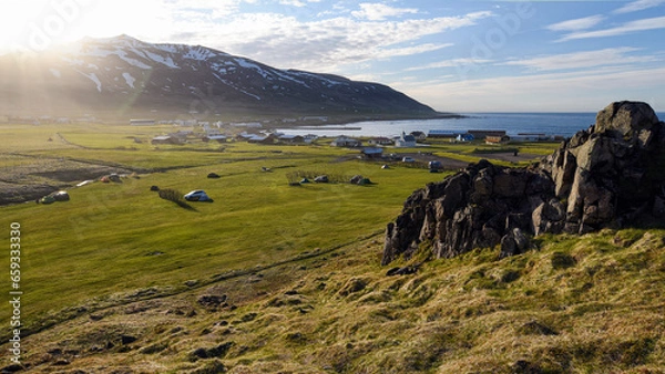 Obraz Sunset over the coastal hamlet of Bakkagerdi ("Bakkagerði" in Icelandic) in eastern Iceland.