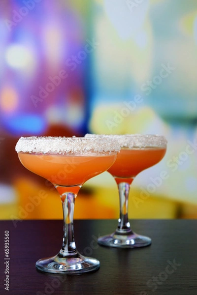 Fototapeta Grapefruit cocktail in glasses on bright background