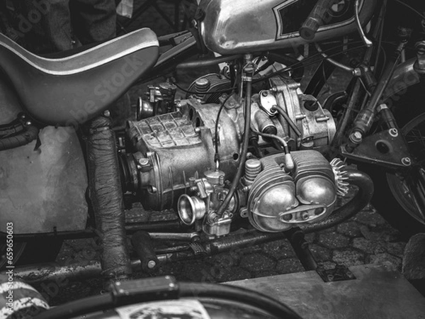 Obraz Close-up of the carburetor engine of an old motorcycle, the old motorcycle engine, black and white.
