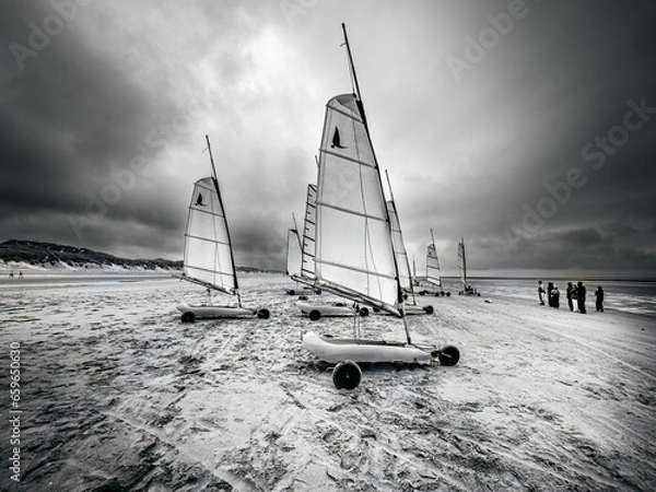 Obraz Escape in sand yachts on a beach at low tide. Black and white of the Coast of Upper Normandy, France
