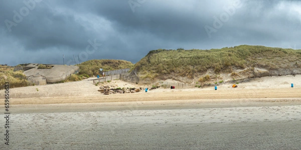 Obraz Panorama of a coast at low tide. An abandoned WW2 bunker and silted dunes. Coastline of Upper Normandy, France