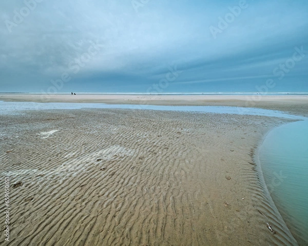 Obraz View of the beach at low tide, a cloudy winter sky and rippled sand. Coastline of Upper Normandy, France