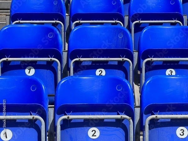 Fototapeta Numbered seats in the stands.