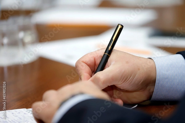 Obraz close up of hand writing on paper