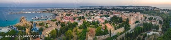 Fototapeta Mandraki port with deers statue, where The Colossus was standing and fort of St. Nicholas. Rhodes, Greece. 