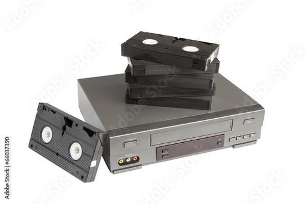 Fototapeta stack of videotapes on videorecorder isolated on white