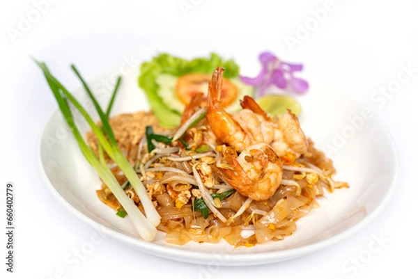Obraz Thai noodle stir fry with a sweet-savoury-sour sauce scattered with crushed peanuts on top with prawn.
