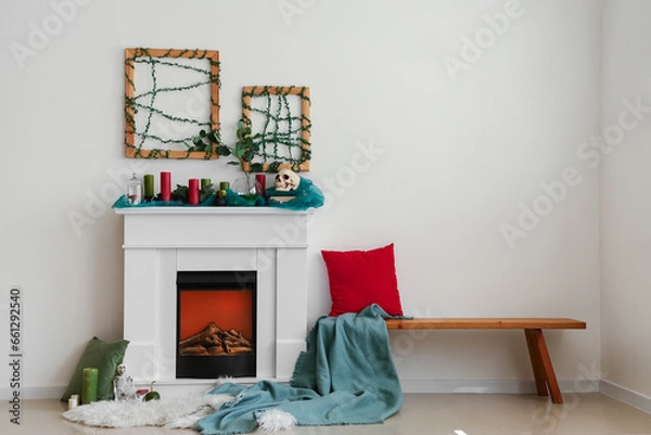 Fototapeta Interior of festive living room with fireplace and Halloween decorations