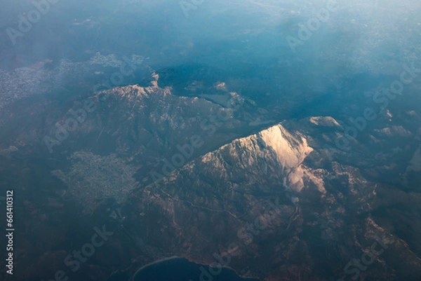 Fototapeta Panoramic view from airplane window of mountain landscape in Cyprus at dawn