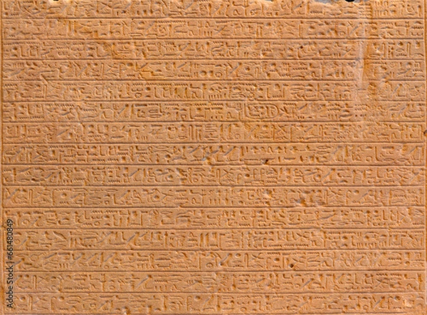 Fototapeta Ancient Egyptian script on red sandstone in pyramid