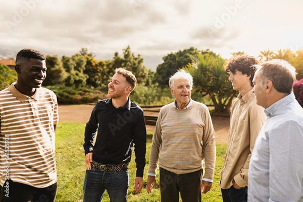 Obraz Happy multigenerational group of men with different ethnicities having fun in a public park - People diversity concept