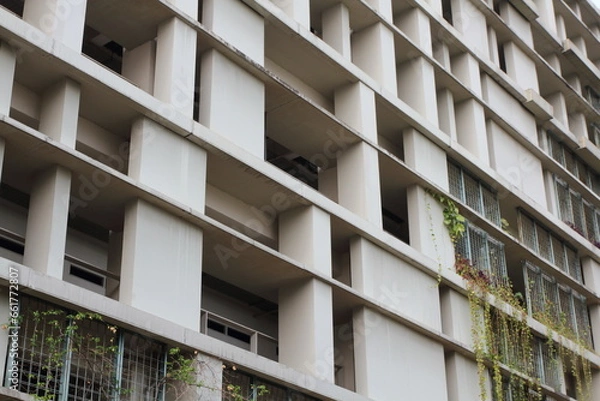 Fototapeta Geometric pattern on building wall facade. Modern architecture.