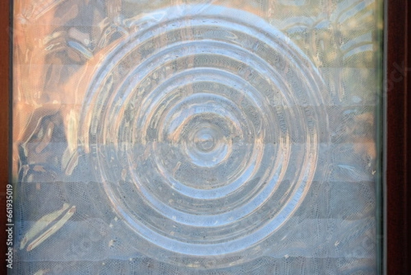 Fototapeta Glass window pane with ripple pattern 