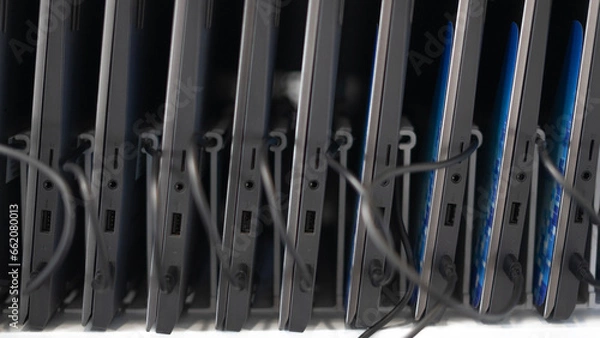 Fototapeta Computers connected and charging ready to use.