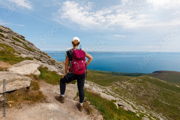 Obraz Hiker on path to Goatfell, view over Firth of Clyde, summers day.