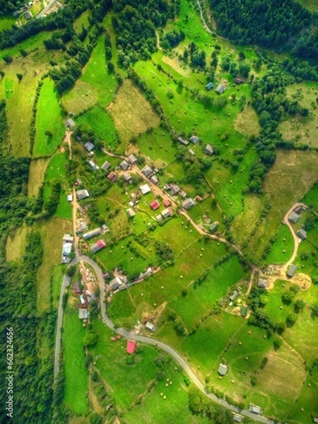 Fototapeta Drone's Eye View: High mountain pass in mountains. Highlands and hills with narrow roads.