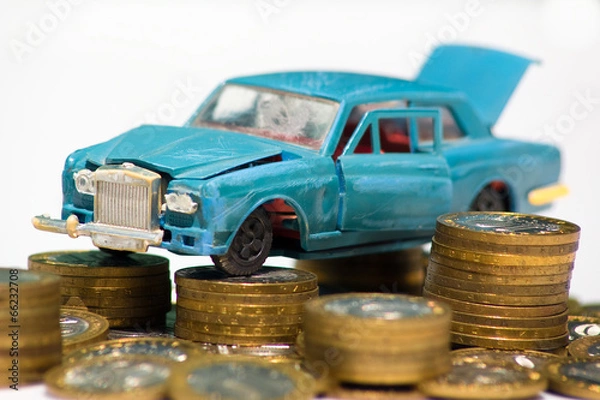 Obraz Разбитая модель автомобиля на монетах