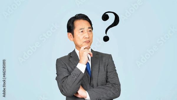 Fototapeta 疑問を持つ中年ビジネスマン