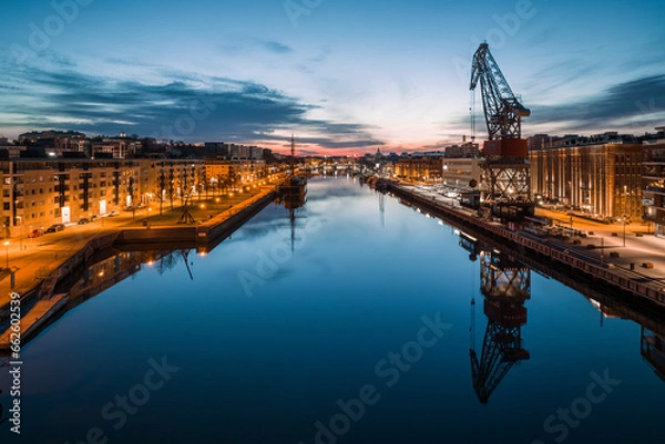 Fototapeta Cityscape of Turku, Finland at dawn and the calm aurajoki river in the city downtown