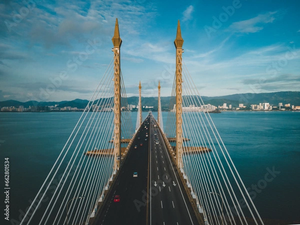 Fototapeta Penang bridge architecture aerial top down view during sunrise.