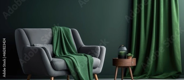 Fototapeta Green blanket on gray sofa in bright living room with empty poster and armchair With copyspace for text