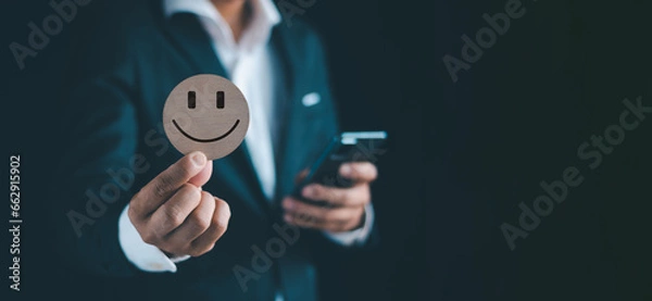 Fototapeta Businessmen hold signboards, smile, be happy, get good feedback, have a cheerful mind, and are satisfied with customer evaluation, which is World Mental Health Day.