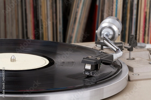Fototapeta Turntable with vinyl records in the back