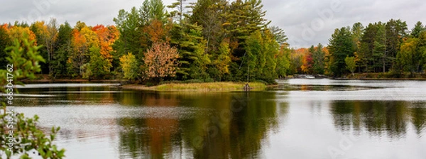 Obraz Waterfalls flowing into Lake of the Falls in Mercer, Wisconsin in September