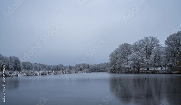 Obraz Frozen lake in northern German countryside after snowfall in winter