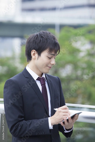 Fototapeta メモをとるビジネスマン