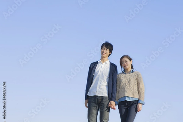 Obraz 手を繋ぐカップル