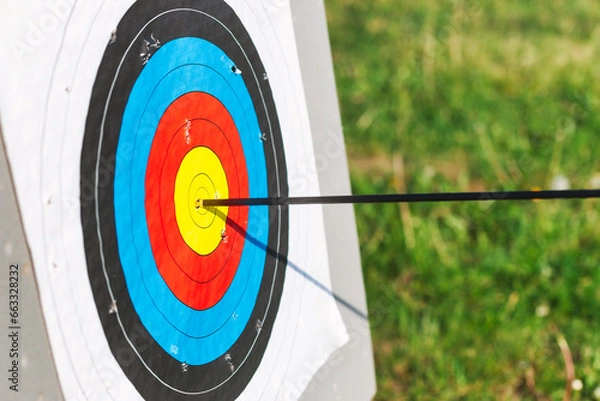Fototapeta Archery target with arrow in bullseye