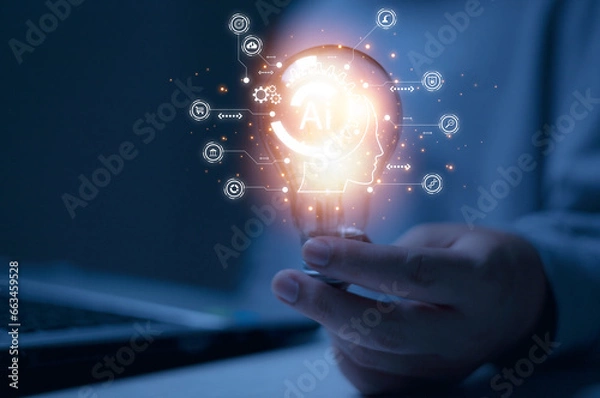 Fototapeta Photo with a man holding a light bulb and a glowing AI icon and a business icon. Concept of using artificial intelligence in business and daily life.