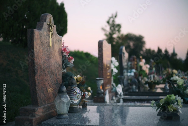 Obraz Close up of Votive candles lantern on the grave in Slovak Catholic cemetery during day. Autumn scene. All Hallows eve. Memorial to the deceased. Solemnity of All Saints. 1st November, All Saints' Day