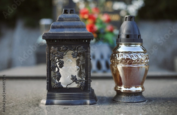 Obraz Close up of Votive candles lantern on the grave in Slovak Catholic cemetery during day. Autumn scene. All Hallows eve. Memorial to the deceased. Solemnity of All Saints. 1st November, All Saints' Day
